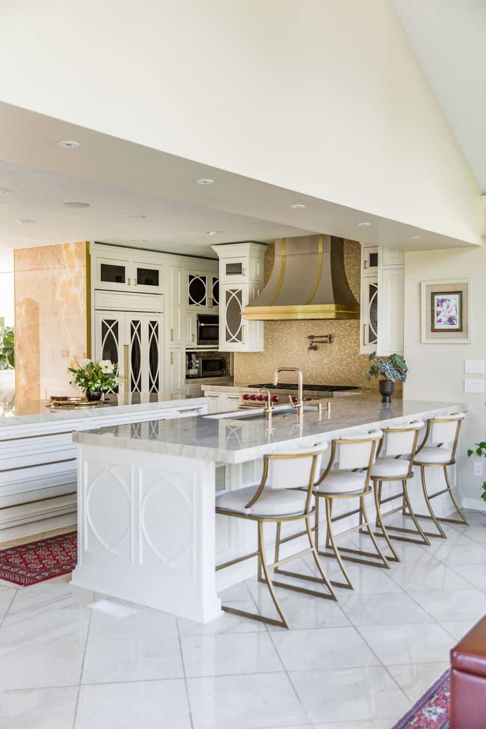 Nicholas Design Build |         A large kitchen with a center island and bar stools, perfect for a remodel.