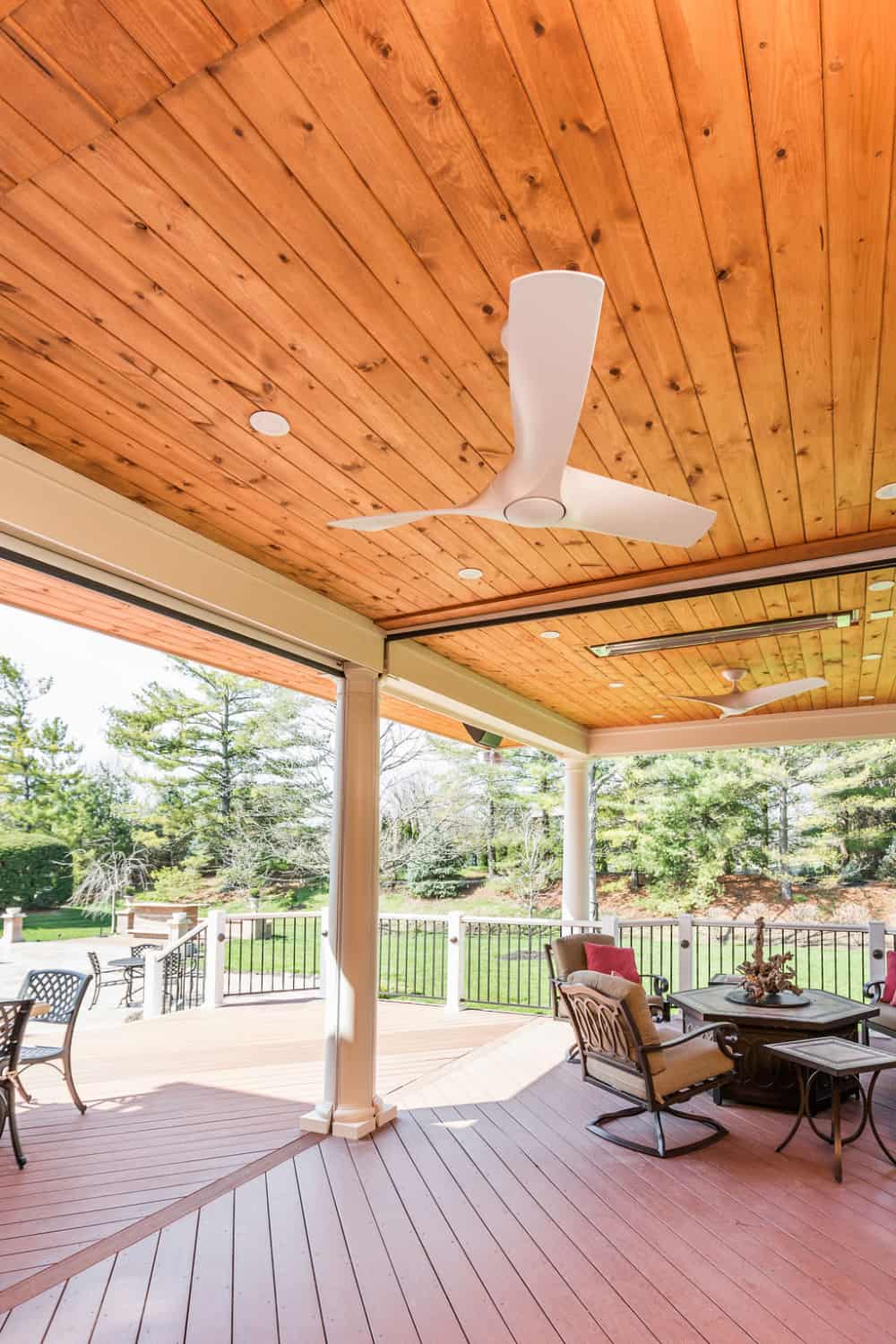 Entertaining porch with ceiling fans, retractable screens and heaters