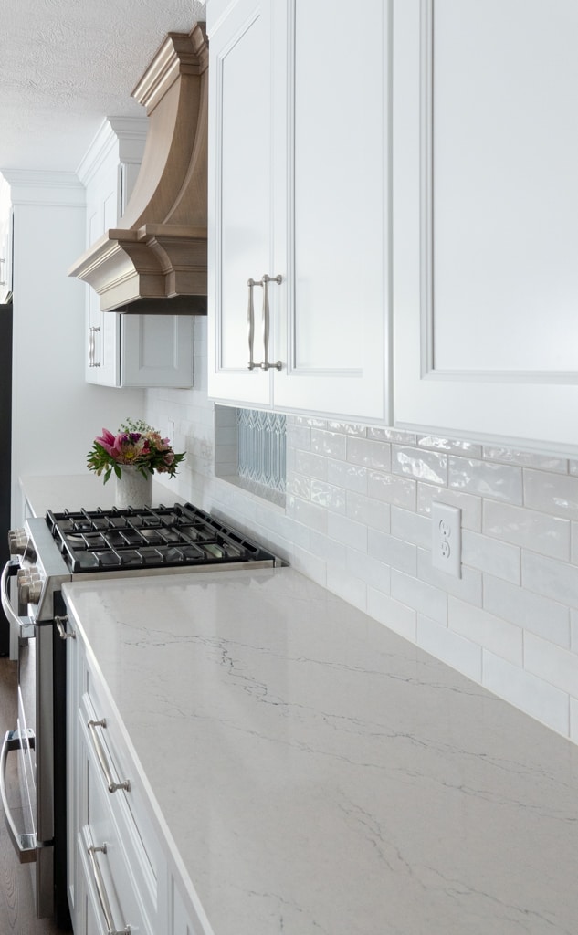 Nicholas Design Build | Remodel the kitchen with white cabinets and marble counter tops.