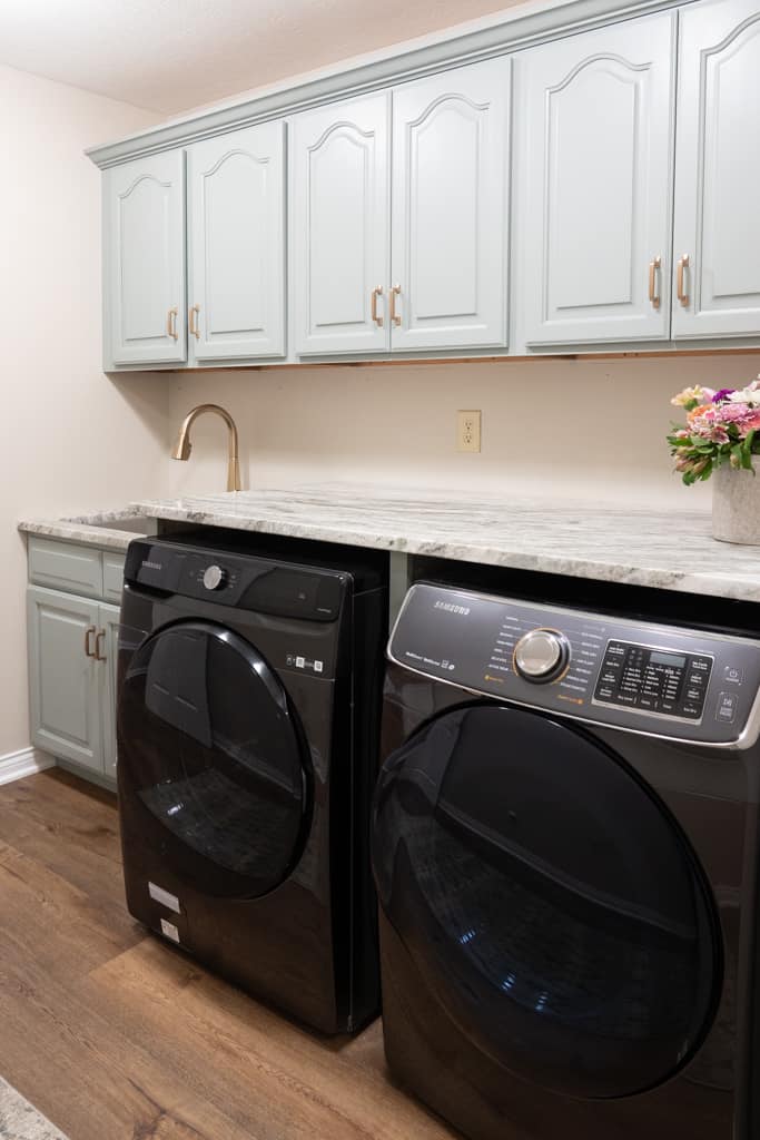Nicholas Design Build | A remodeled laundry room with a washer and dryer.