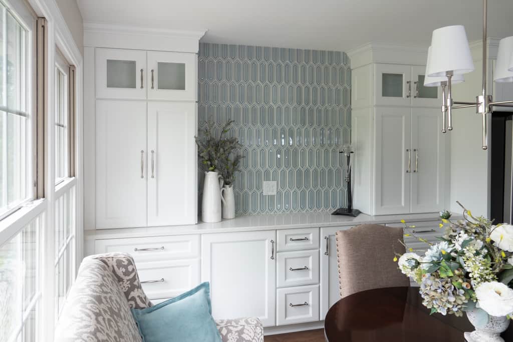 Nicholas Design Build | Remodel a dining room with white cabinets and blue tile.