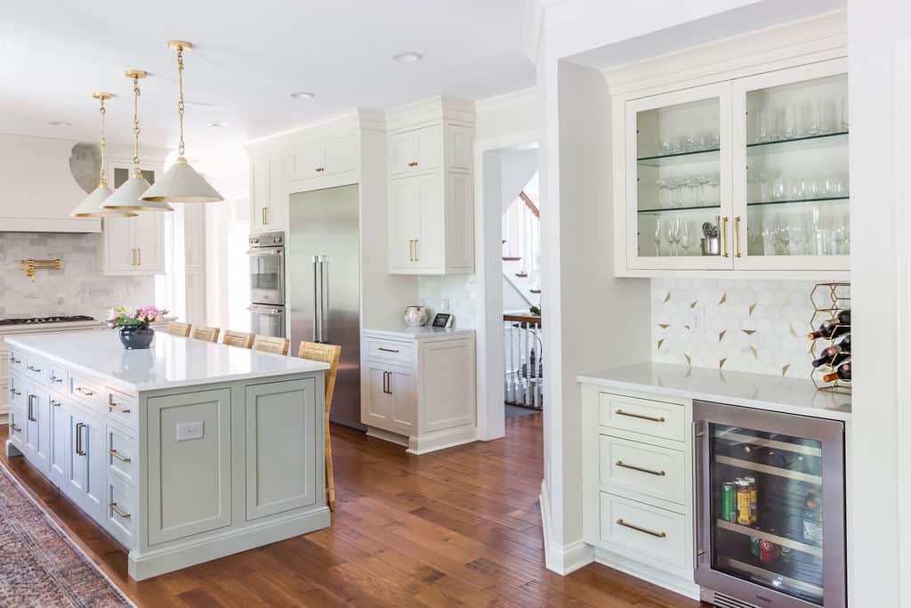 Nicholas Design Build | Remodeling a kitchen with white cabinets and a center island.