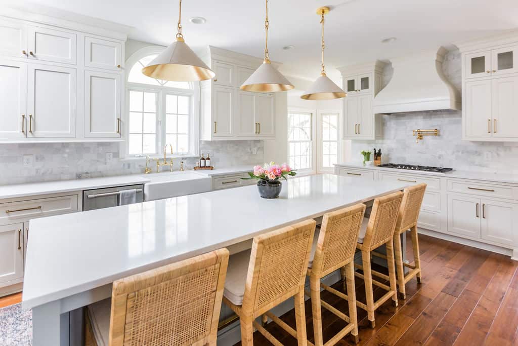 Nicholas Design Build Carmel Kitchen | A remodeled kitchen with a center island and stools.