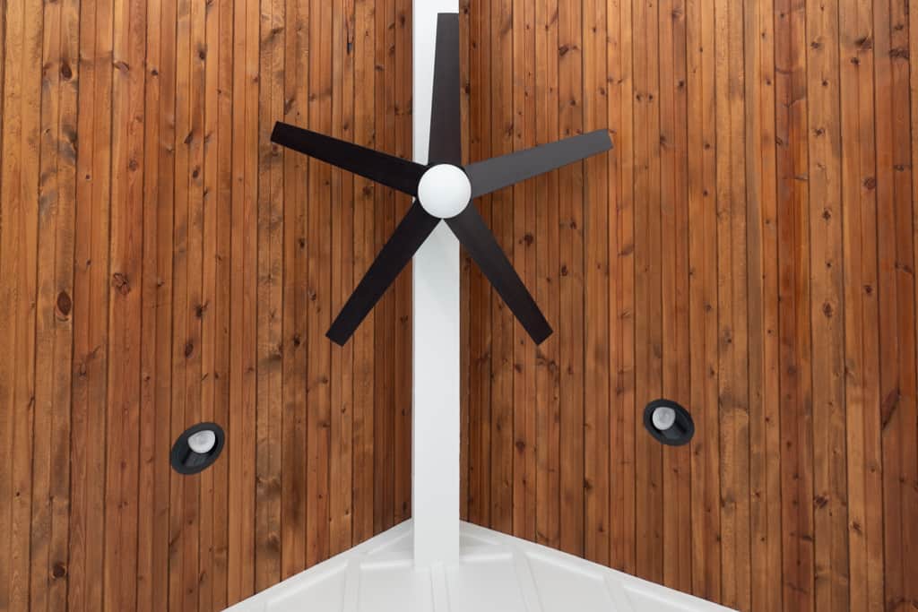 Nicholas Design Build | A remodeled wooden wall with a fan on it.