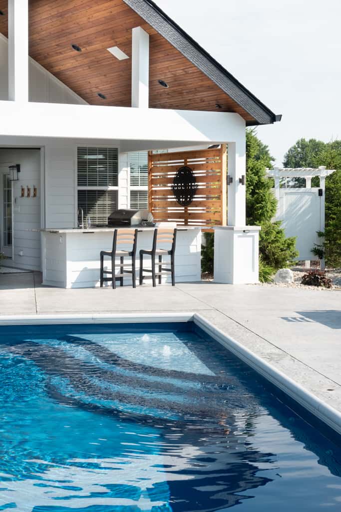 Nicholas Design Build | Remodel a swimming pool with a bar and grill.