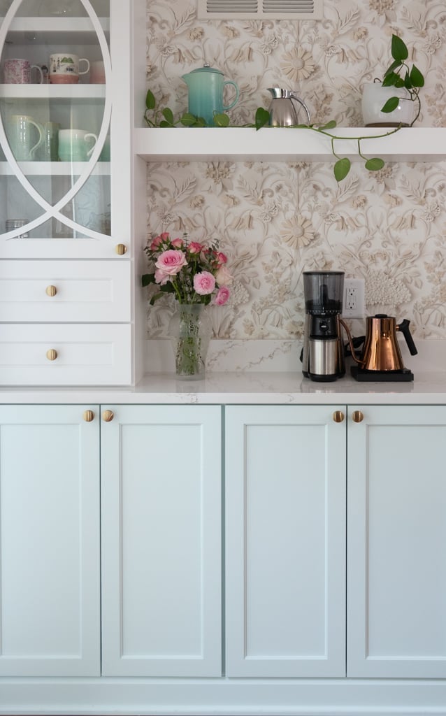 Nicholas Design Build | Remodel a kitchen with white cabinets and floral wallpaper.