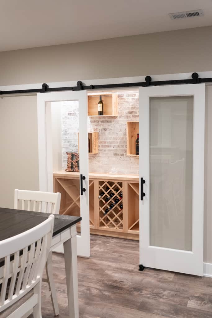 Nicholas Design Build | Remodeling a dining room with a sliding barn door.
