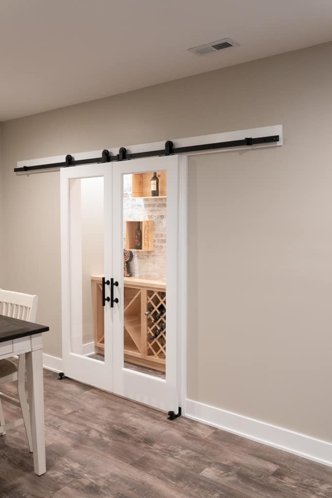 Nicholas Design Build | Remodel a dining room with a sliding barn door.