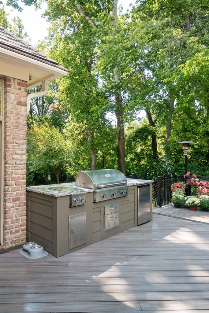 Nicholas Design Build | An outdoor kitchen with a grill and sink.