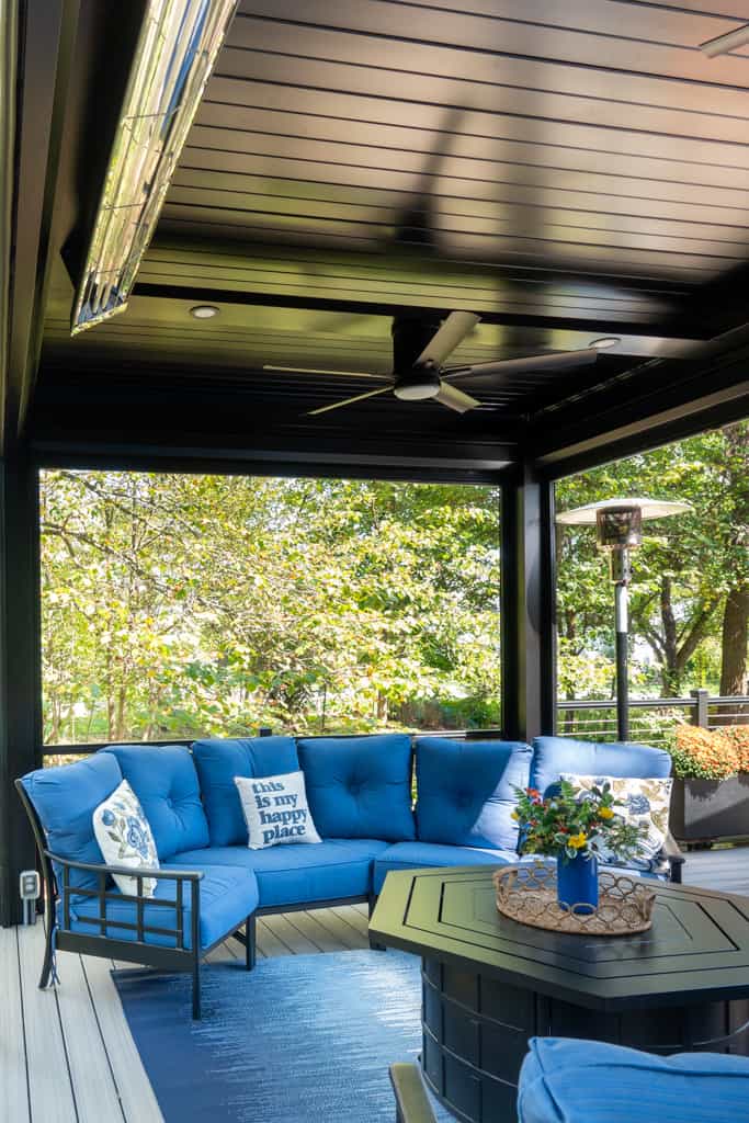 Nicholas Design Build | A blue couch on a deck.