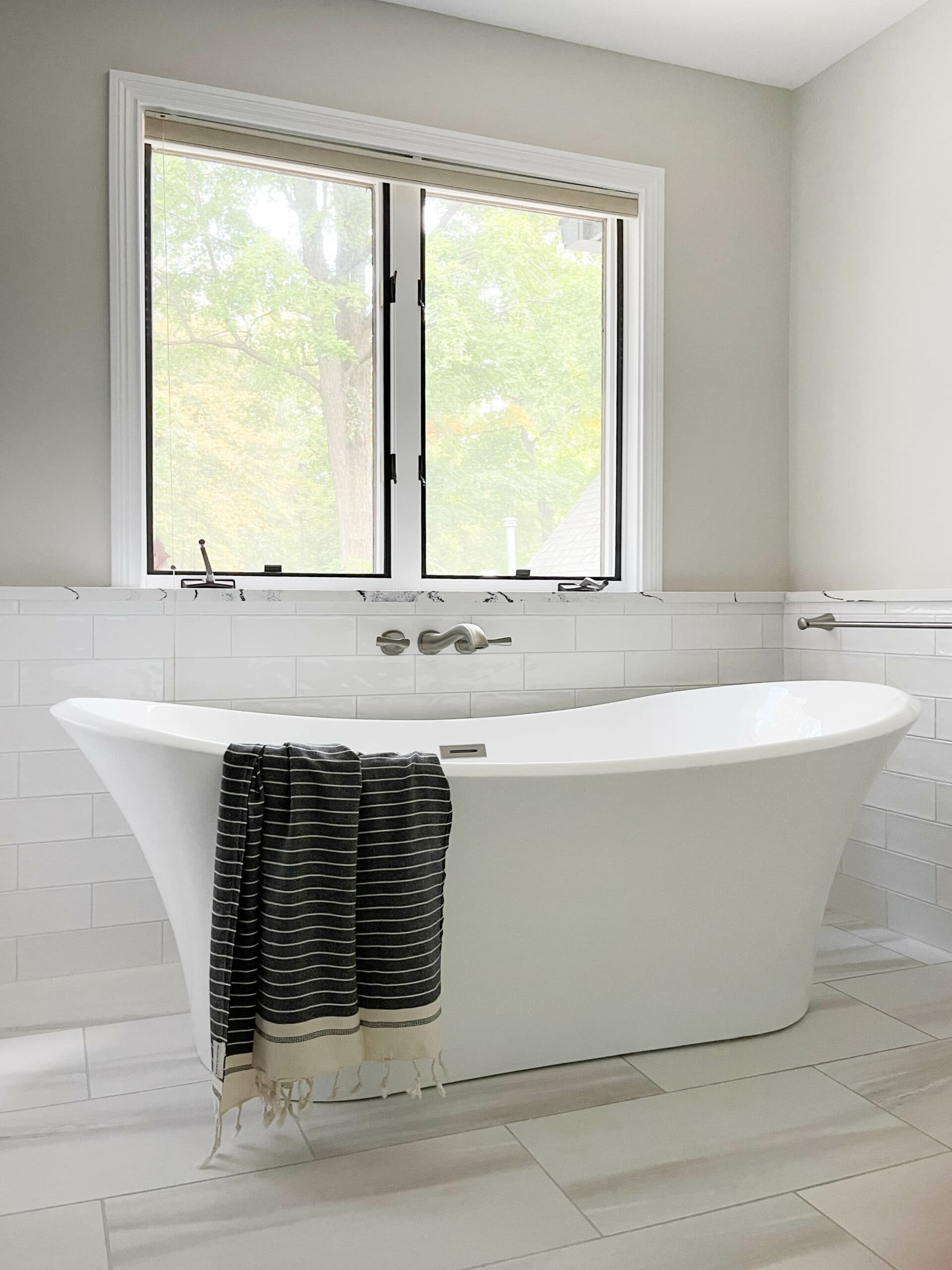 Nicholas Design Build | A white bathtub in a bathroom.