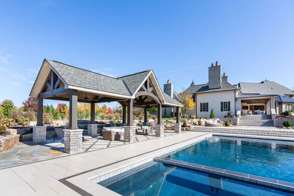 Nicholas Design Build | A swimming pool with a gazebo and patio.