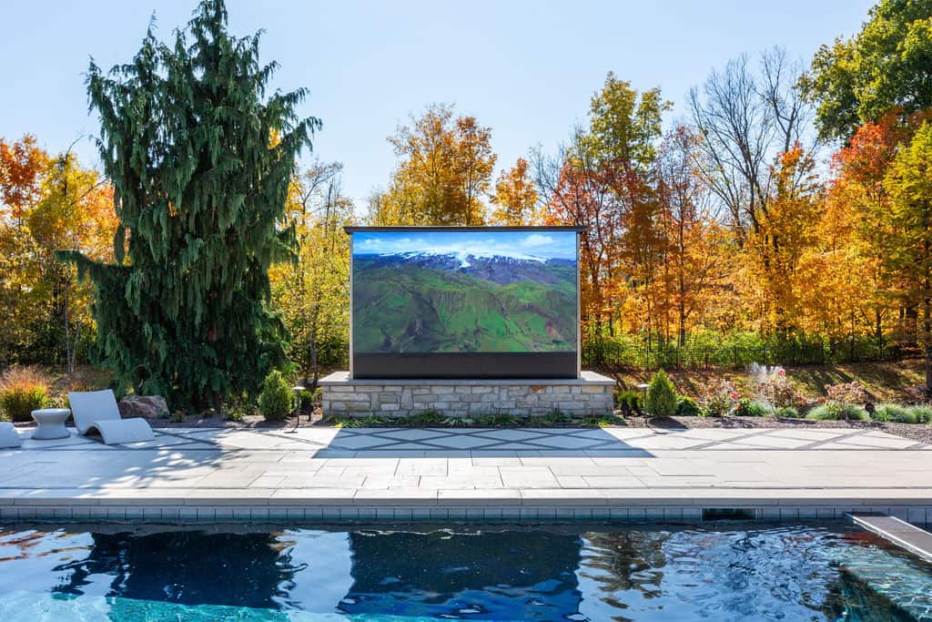 Nicholas Design Build | A large outdoor screen in a swimming pool.